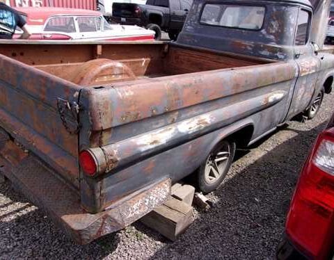 Rusty vintage pickup truck with empty bed