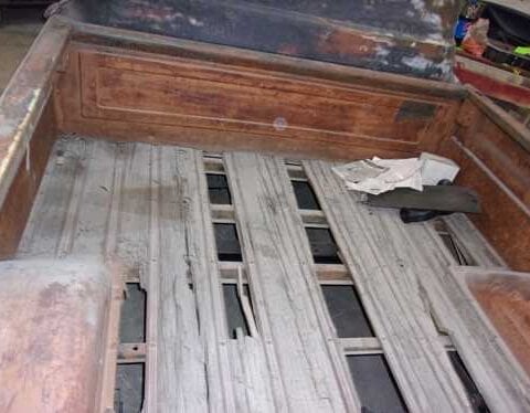 Old pickup truck bed with broken planks
