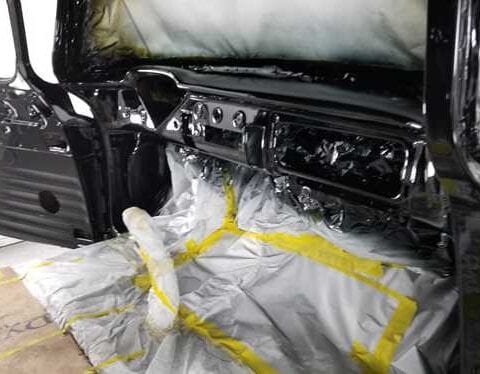 Car interior masked and freshly painted glossy black