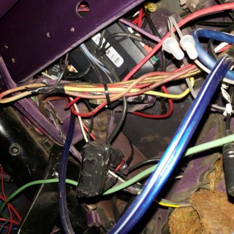 Colorful tangled electrical wires inside vehicle