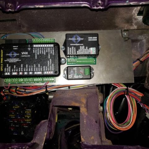 Car firewall with mounted electronic modules and wiring