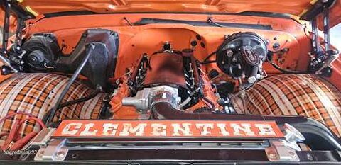 Close-up of an engine bay with 'CLEMENTINI' on the front panel.
