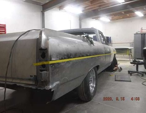 Classic car undergoing restoration in workshop