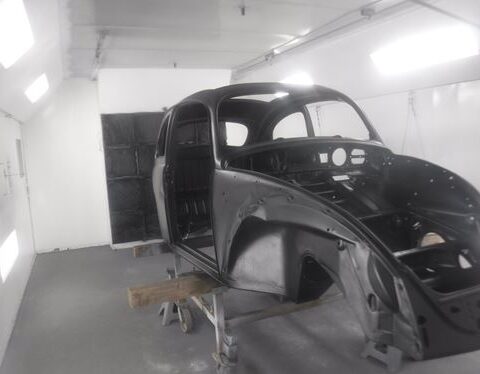 Classic Volkswagen Beetle body in paint booth