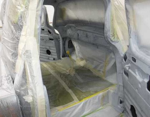 Car interior masked for painting and priming